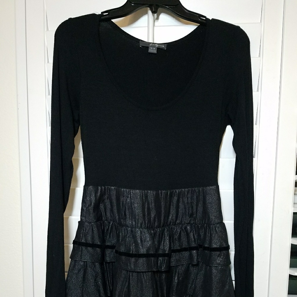 Long-sleeve black and shiny frilly dress